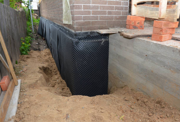 Happy homeowners after waterproofing job in Leiters Ford